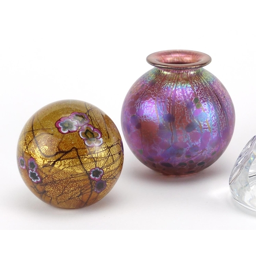 2214 - Glassware comprising a Norman Stuart Clarke iridescent paperweight, Isle of Wight vase and paperweig... 