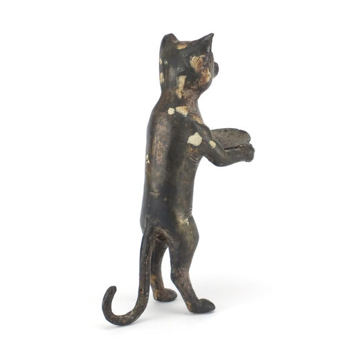 2303 - Bronzed model of a standing cat holding a plate, 27cm high