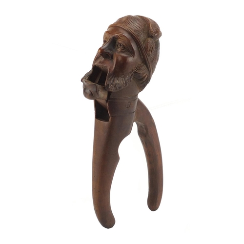 76 - Black Forest carved bearded gentleman nut crackers, 21cm in length