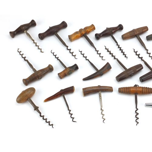 94 - Twenty six mostly antique straight pull corkscrews with steel worms, including some with turned wood... 