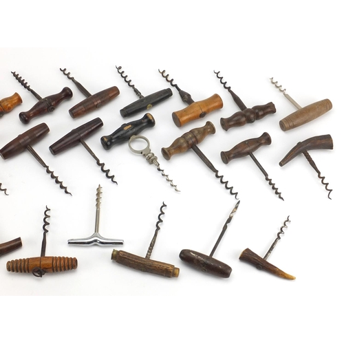 94 - Twenty six mostly antique straight pull corkscrews with steel worms, including some with turned wood... 