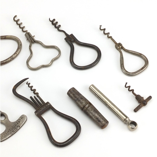 91 - Antique and later advertising corkscrews including three travelling examples, five Georgian steel fo... 