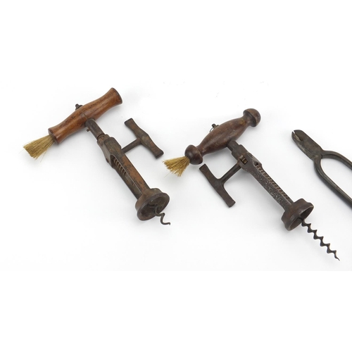 88 - Two 19th century two pillar corkscrews with side brushes and a pair of 19th century champagne pliers... 