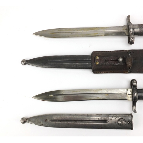 375 - Two Swedish Military interest mauser bayonets, one with leather frog, both with various impressed ma... 