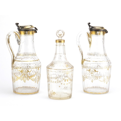 737 - Pair of early 19th century French cut glass claret jugs with silver gilt lids and a similar decanter... 