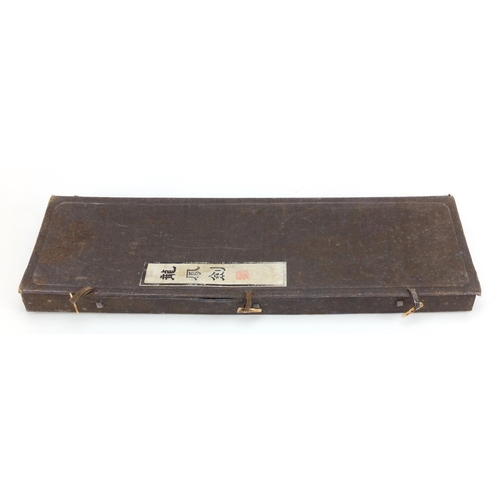 578 - Two Chinese gilt decorated black ink stone swords, housed in a fitted case with calligraphy, each 43... 