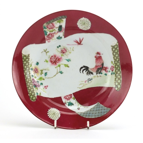 387 - Chinese porcelain red ground shallow dish, hand painted in the famille rose palette with a cockerel,... 