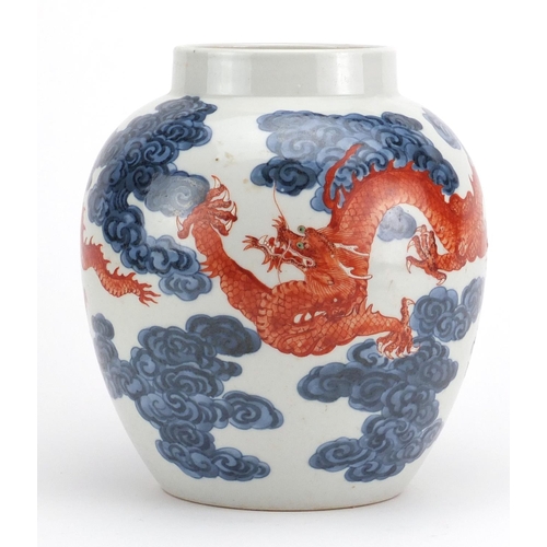 447 - Chinese blue and white porcelain vase, hand painted in iron red with two dragons amongst clouds, six... 