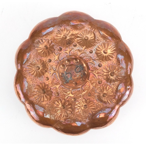 796 - Arts & Crafts copper candlestick by Keswick, embossed with stylised flowers, impressed marks, 18cm i... 