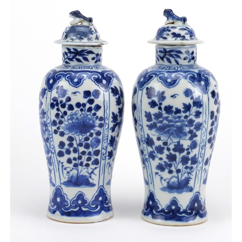 466 - Pair of Chinese blue and white porcelain baluster vases with covers, hand painted with flowers, four... 
