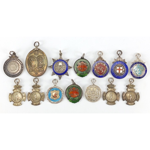 251 - Fourteen silver jewels, some with enamel including athletics, Blackheath Royal Golf Club, Football A... 