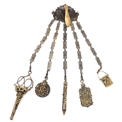 47 - 19th century gilt metal chatelaine with griffins, having five implements including aide memoire, pro... 