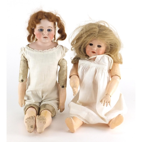 150 - Two bisque headed dolls including an Armand Marseille 971 example, both with jointed limbs, the larg... 
