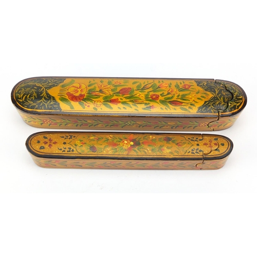 641 - Two Islamic lacquered pen boxes hand painted with flowers, the largest 26.5cm wide