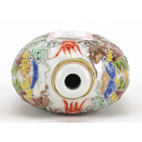 428 - Chinese porcelain relief snuff bottle, hand painted in the famille verte palette with dragons and ca... 