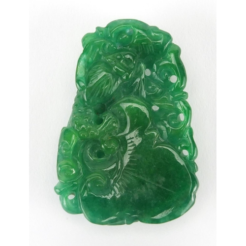 531 - Chinese green jade pendant carved with a dragon, 5cm high