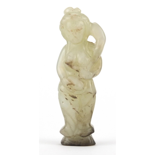 527 - Chinese celadon and russet jade carving of a female, 7.5cm high