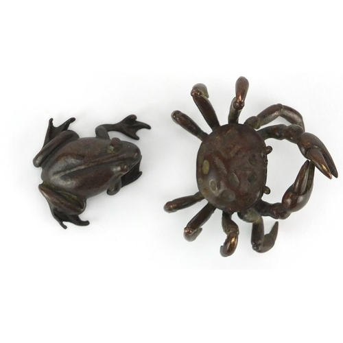 577 - Japanese patinated bronzes comprising a crab and a frog, the crab with character marks to the unders... 