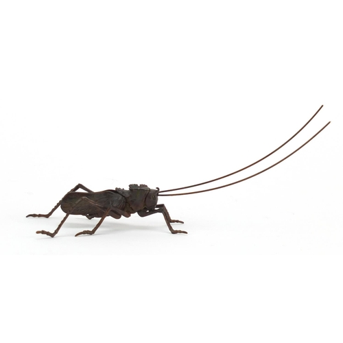 573 - Japanese patinated bronze cricket with articulated legs and antennas, 12cm in length