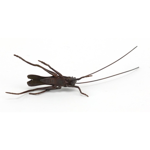 573 - Japanese patinated bronze cricket with articulated legs and antennas, 12cm in length