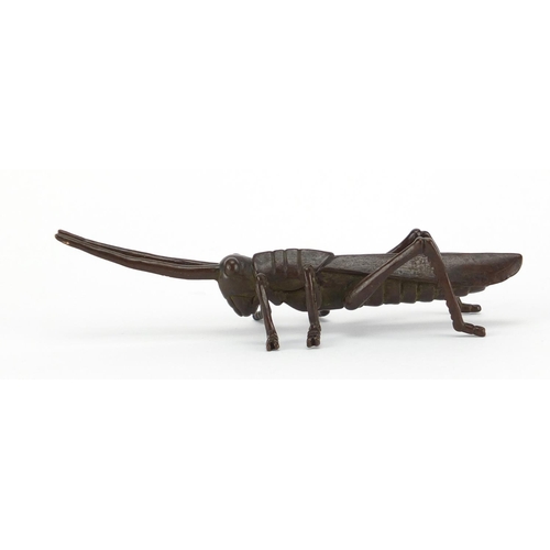 575 - Japanese patinated bronze locust, character marks to the underside, 11.5cm in length