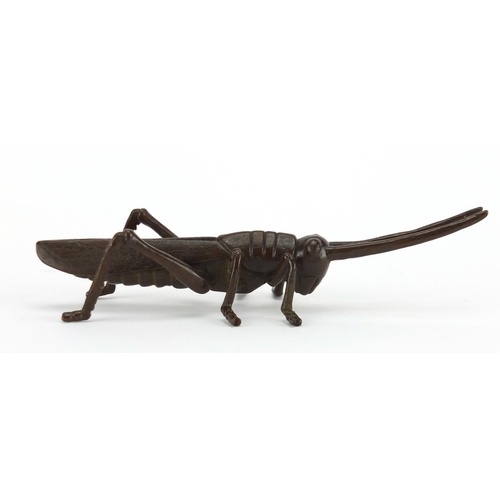 575 - Japanese patinated bronze locust, character marks to the underside, 11.5cm in length