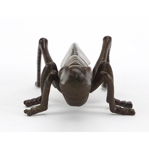 575 - Japanese patinated bronze locust, character marks to the underside, 11.5cm in length