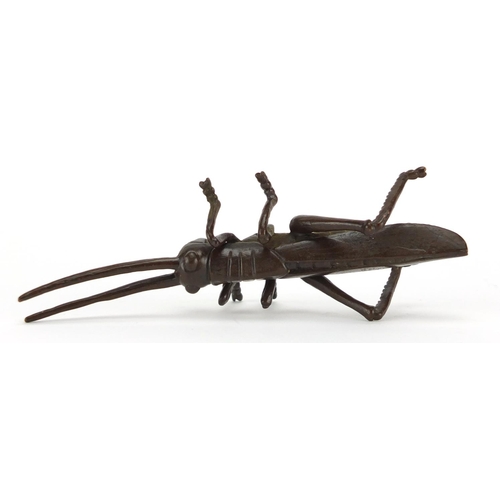 575 - Japanese patinated bronze locust, character marks to the underside, 11.5cm in length