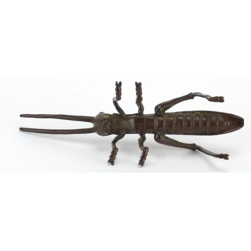 575 - Japanese patinated bronze locust, character marks to the underside, 11.5cm in length