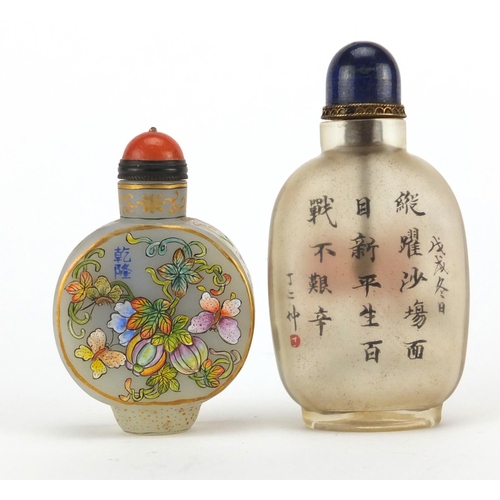 537 - Two Chinese glass snuff bottles with stoppers, one enamelled with butterflies amongst flowers, the o... 