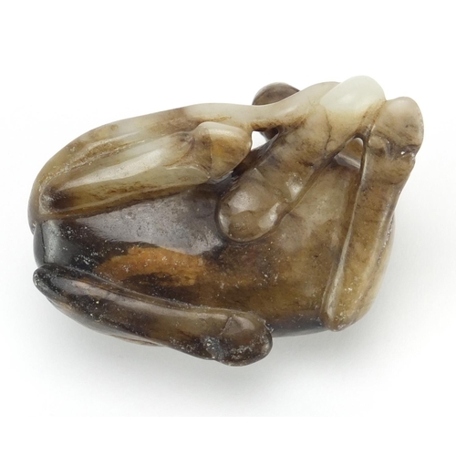 529 - Chinese russet and white jade carving of a foal, 8.5cm wide