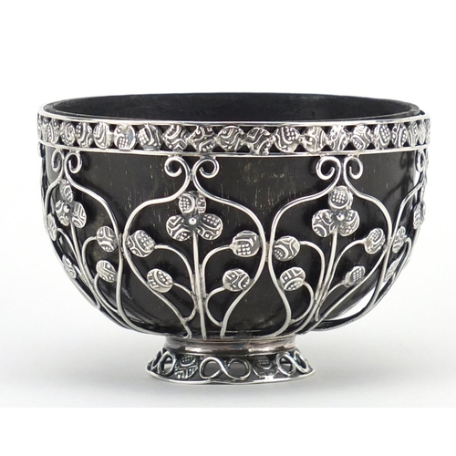 877 - Unmarked silver coconut footed bowl, set with miniature middle Eastern coins, 6cm high x 9cm in diam... 