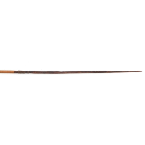 659 - Tribal art including an Aboriginal boomerang of typical form, the largest 129cm in length