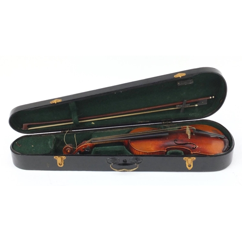 136 - Old wooden violin with bow and case, bearing a Music House paper label, the violin back 13.5inches i... 