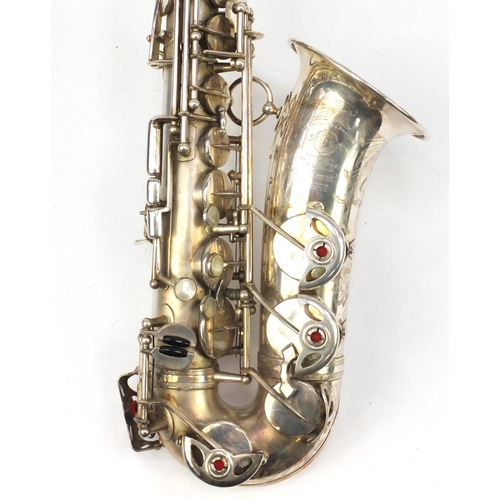 134 - Vintage French silver plated saxophone by Henri Selmer, with mouth piece and case, serial number 215... 