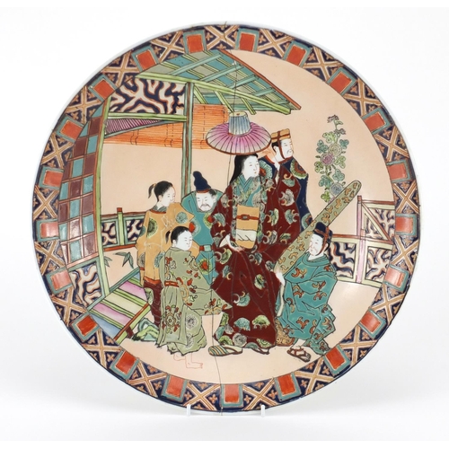 506 - Large Japanese porcelain shallow dish, hand painted with figures and a Geisha, 41.5cm in diameter