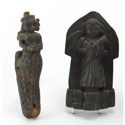 43 - Antique wood carvings including an 18th century Indian example of a robed figure and a lions head, t... 