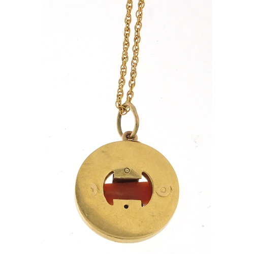 941 - Art Deco unmarked gold, diamond and coral pendant on a 14ct gold necklace, the pendant 1.8cm in diam... 