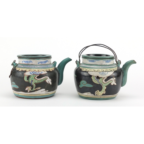 475 - Pair of Chinese yixing terracotta teapots, each enamelled with dragons chasing the flaming pearl, im... 