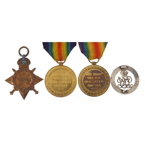 340 - Three British Military World War I medals and a services rendered brooch, the victory medals awarded... 
