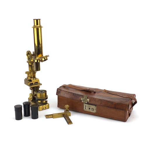 83 - Victorian R & J Beck brass travelling microscope with lenses, housed in a brown leather case, serial... 