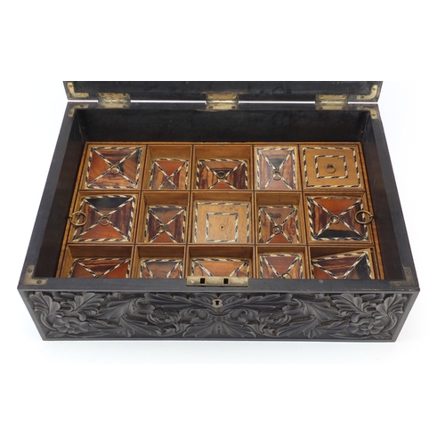 644 - **Withdrawn**Anglo-Indian ebony box profusely carved with flowers, the hinged lid opening to reveal ... 