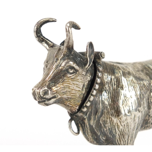 846 - Antique continental silver model of a bull with hinged head, 8.7cm in length, approximate weight 58.... 