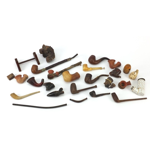 69 - Antique and later smoking pipes and bowls including Turkish Tophane terracotta, ivory and figural ex... 
