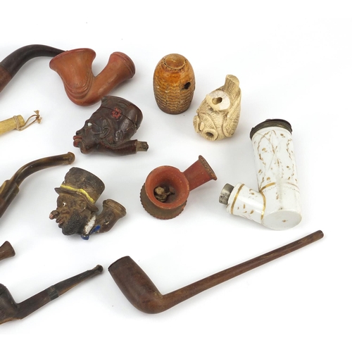 69 - Antique and later smoking pipes and bowls including Turkish Tophane terracotta, ivory and figural ex... 