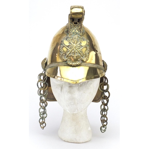 355 - 19th century French brass fireman's helmet with leather liner, 26.5cm high