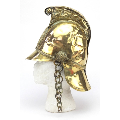 355 - 19th century French brass fireman's helmet with leather liner, 26.5cm high