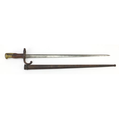 372 - French military interest long bayonet, with scabbard and impressed marks, the largest 65.5cm in leng... 