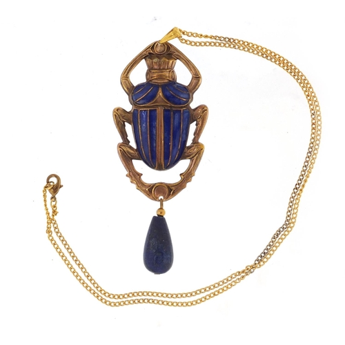 818 - Egyptian Revival jewellery comprising an enamelled beetle pendant with lapis lazuli drop on chain an... 