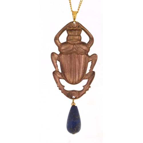 818 - Egyptian Revival jewellery comprising an enamelled beetle pendant with lapis lazuli drop on chain an... 